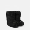 Bottes en peau lainée Gianni Ribbon