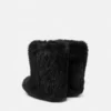 Bottes en peau lainée Gianni Ribbon