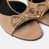 Mules à nœud Opera en cuir verni 85 mm Mules à nœud Opera en cuir verni 85 mm