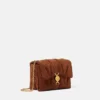 Sac à bandoulière Kleio en daim matelassé Sac à bandoulière Kleio en daim matelassé