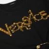 T-shirt court à épingles de sûreté cloutées